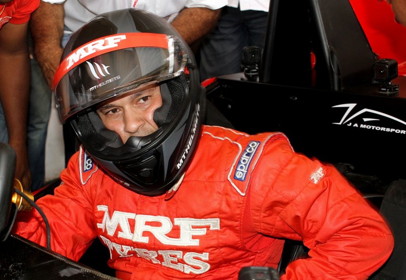 Sachin Tendulkar preparing for a drive in a two-seater racing car at the MRF Challenge in Chenna.JPG