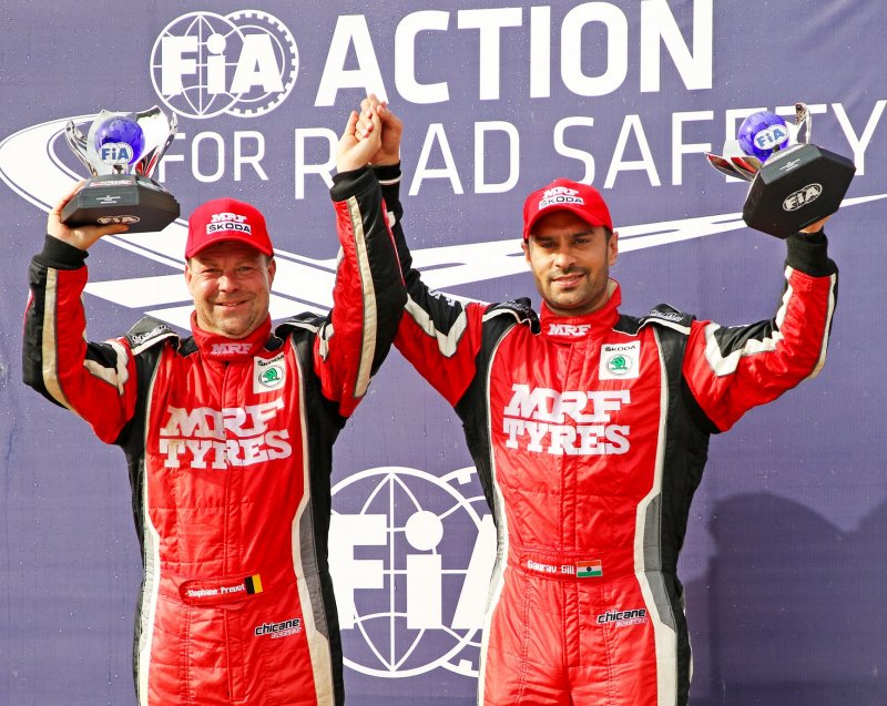 India's Gaurav Gill (right) and co-driver Stephane Prevot from Belgium with the FIA  APRC trophy.JPG