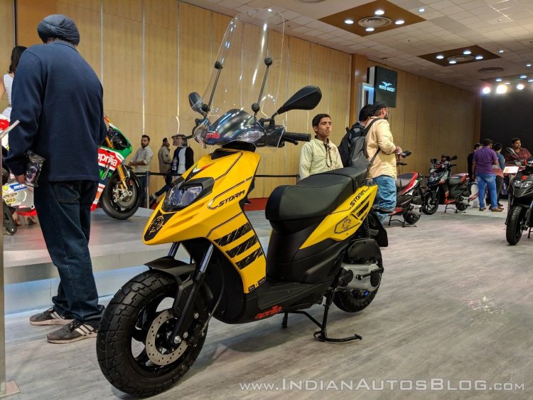 Aprilia-Storm-Yellow-with-accessories-front-left-quarter-at-2018-Auto-Expo.jpg