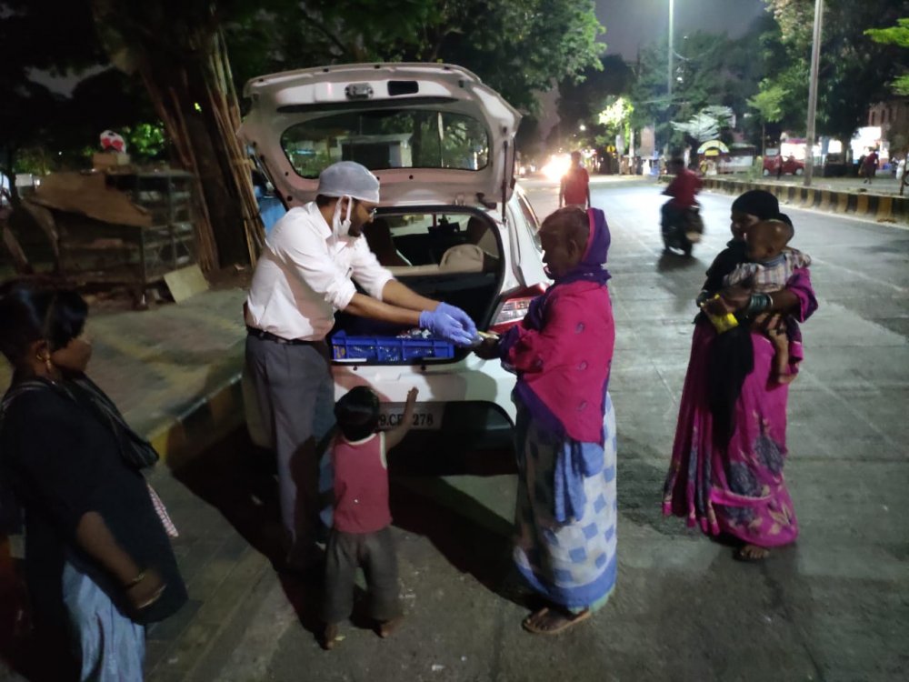 TML distributing cooked meal during dinner time.jpg