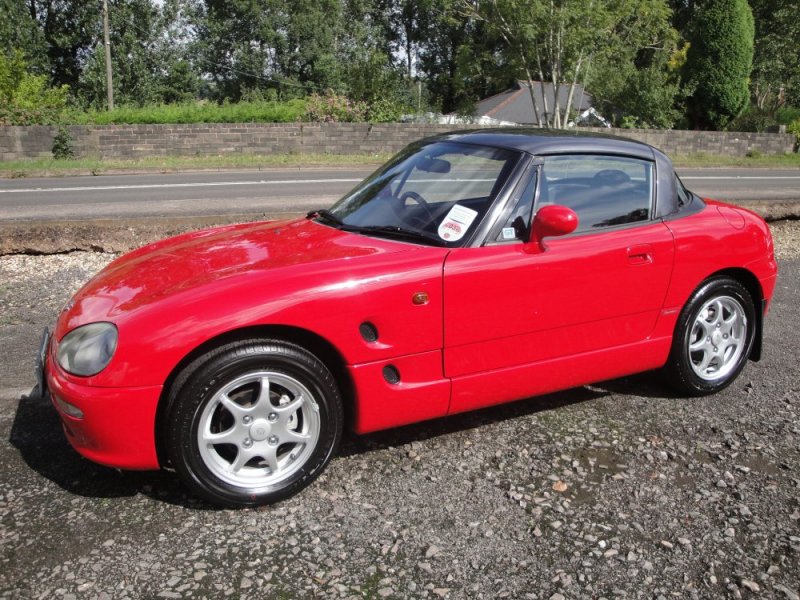 Suzuki_Cappuccino_roof_up.jpg