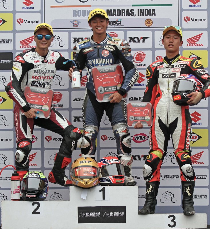 Yuki Ito (centre), winner of the SuperSports 600cc race, flanked by second-placed Md Zaqhwan Zai.JPG