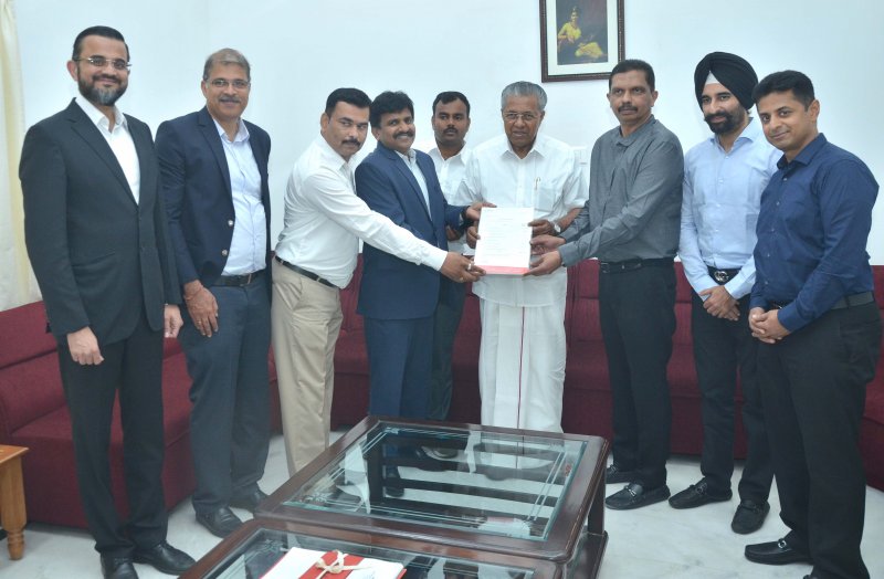 Mr. N. Raja, Deputy Managing Director - Toyota Kirloskar Motor handing over the contribution amo.jpg